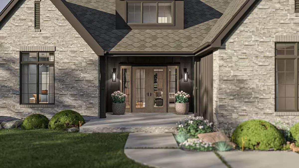 Admire the Wide Double Doors Framed by Stonework in This Craftsman Entryway