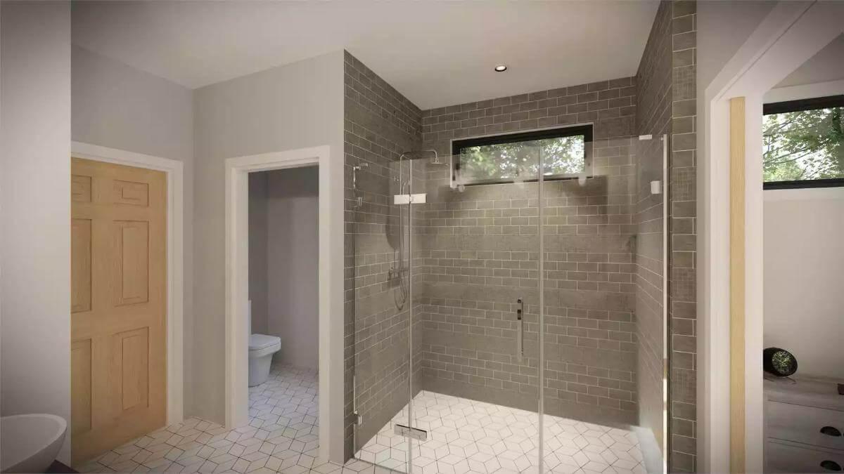 Modern Bathroom with a Striking Glass Shower and Stone Tiles