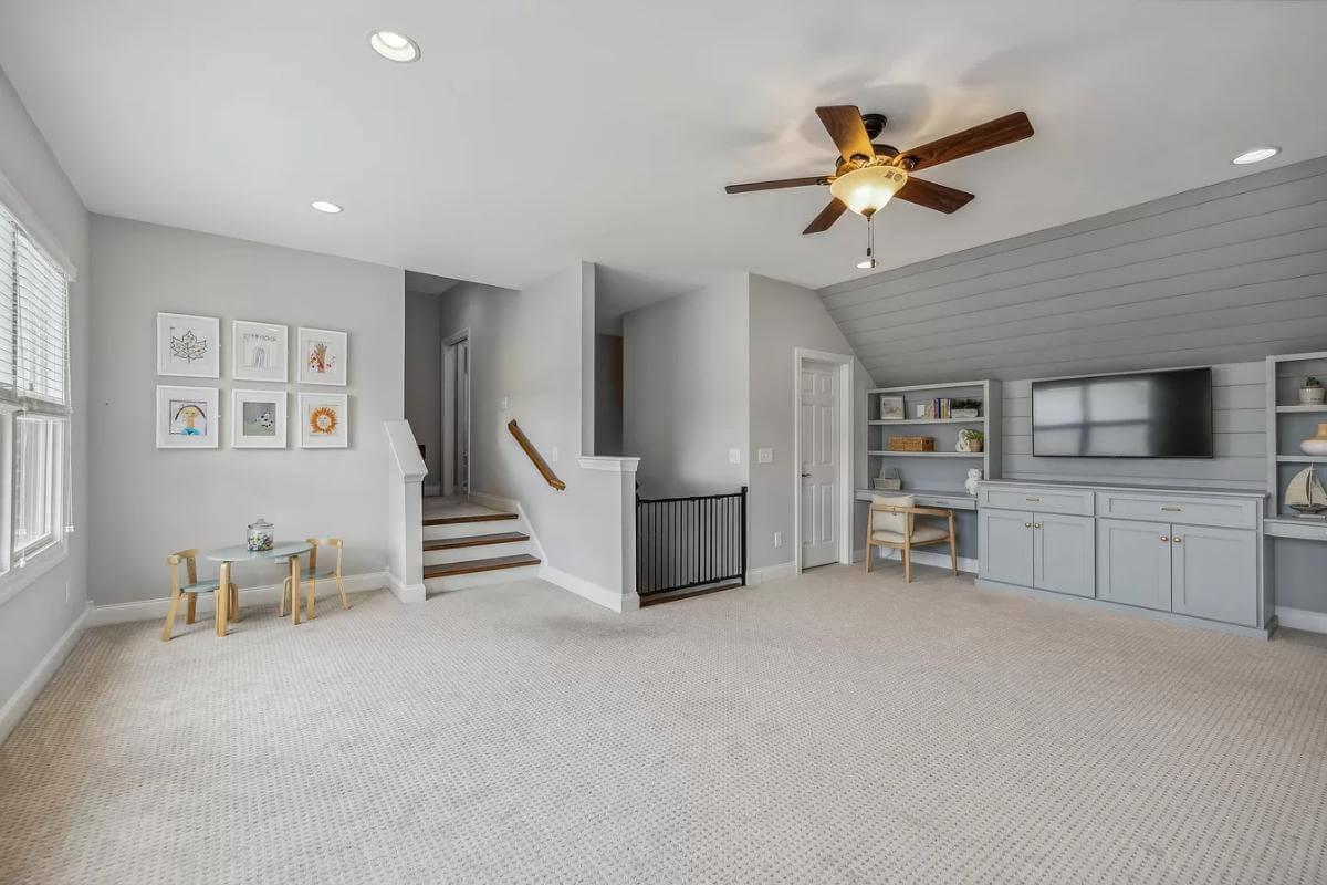 Look at This Cozy Bonus Room with Built-In Media Center