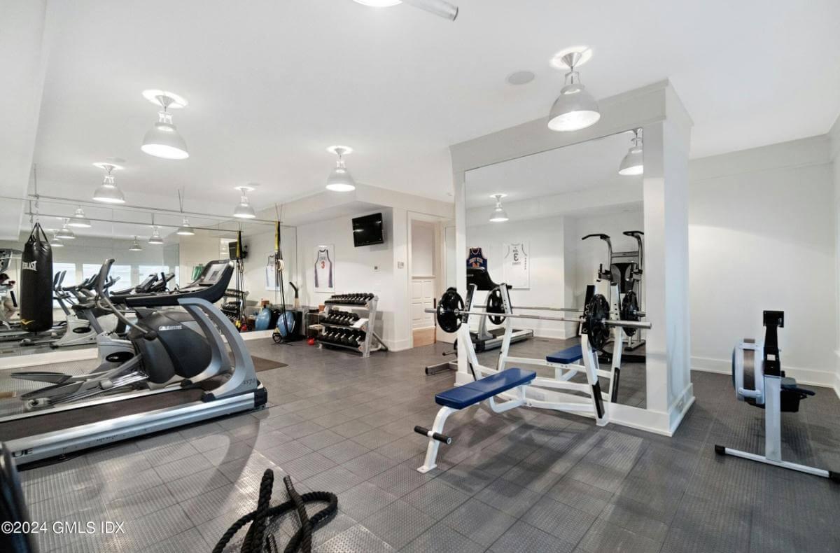 Check Out This Fully Equipped Home Gym with Charming Sports Accents