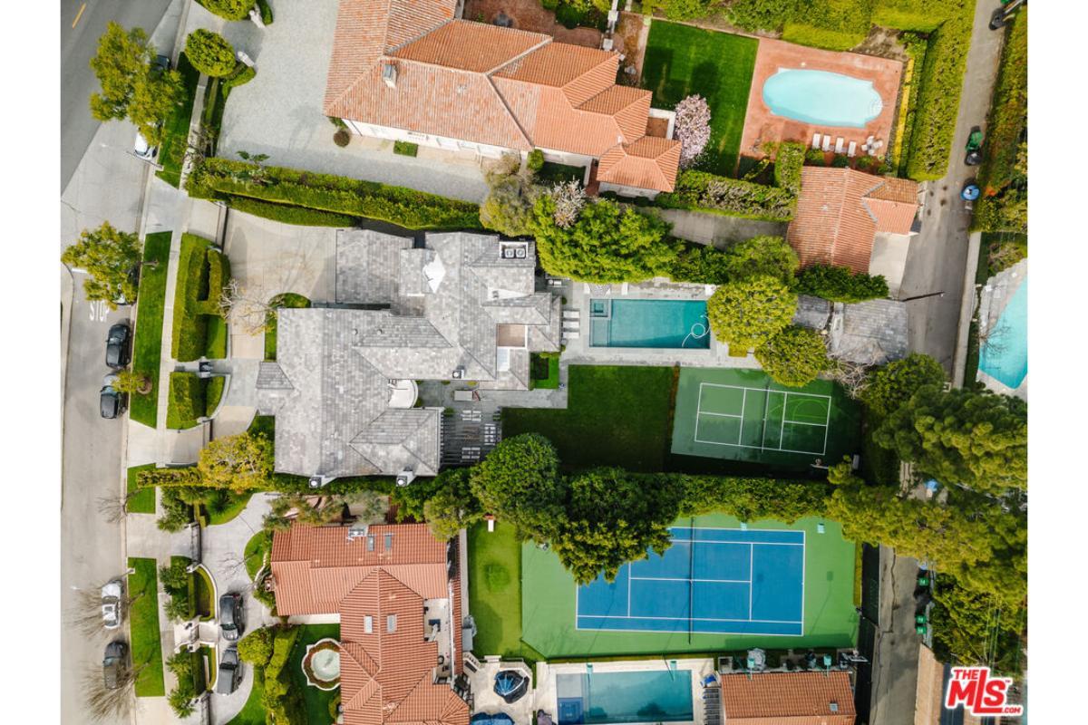 Aerial View of a Luxurious Estate with Tennis Court and Pool