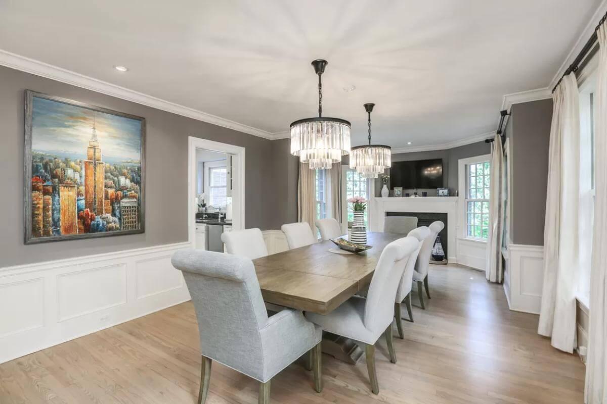 Elegant Dining Room with Striking Artwork and Crystal Chandeliers