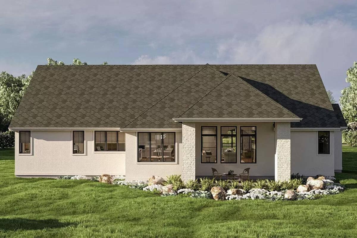 Admire the Expansive Rear Patio with Tranquil Landscaped Surroundings