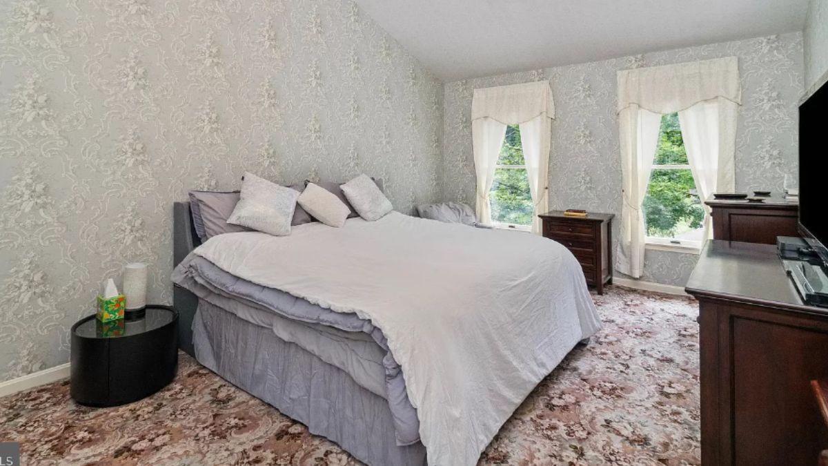 Relax in This Cozy Bedroom with Intricate Floral Accents