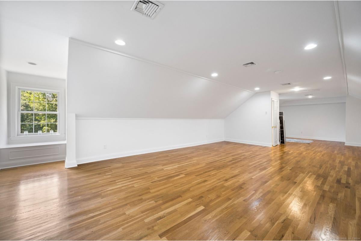 Wow, Look at This Spacious Bonus Room with Gleaming Hardwood Floors
