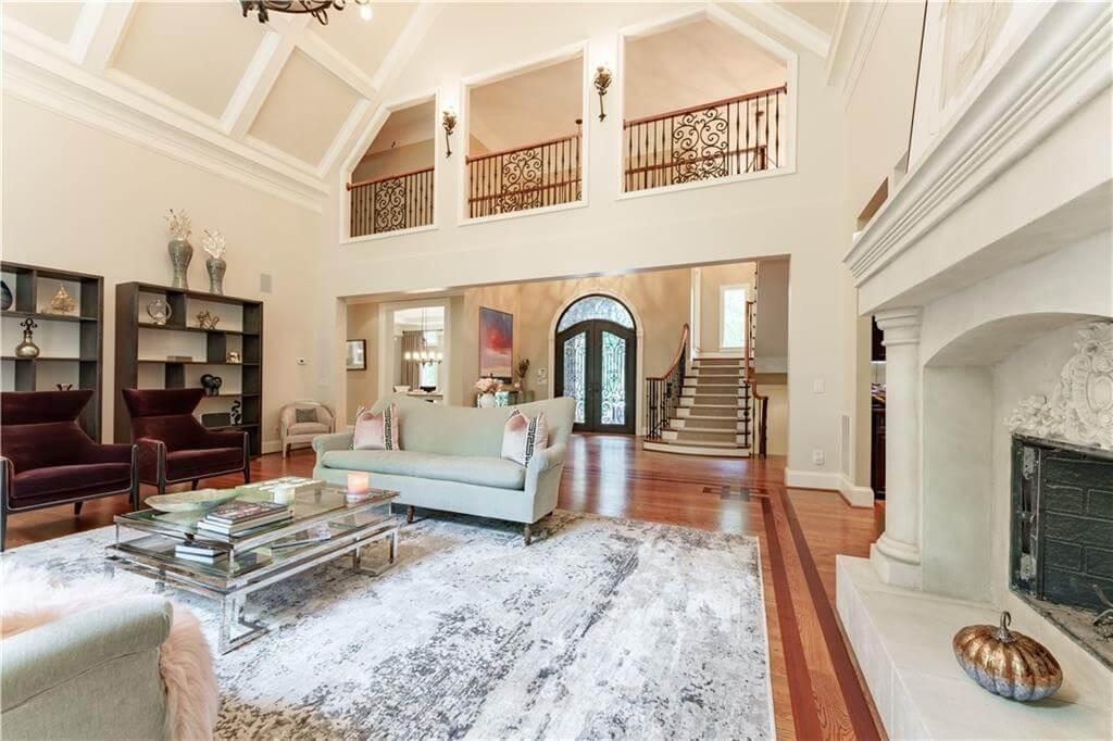 Wow, Check Out the Vaulted Ceilings and Elegant Fireplace in This Living Room