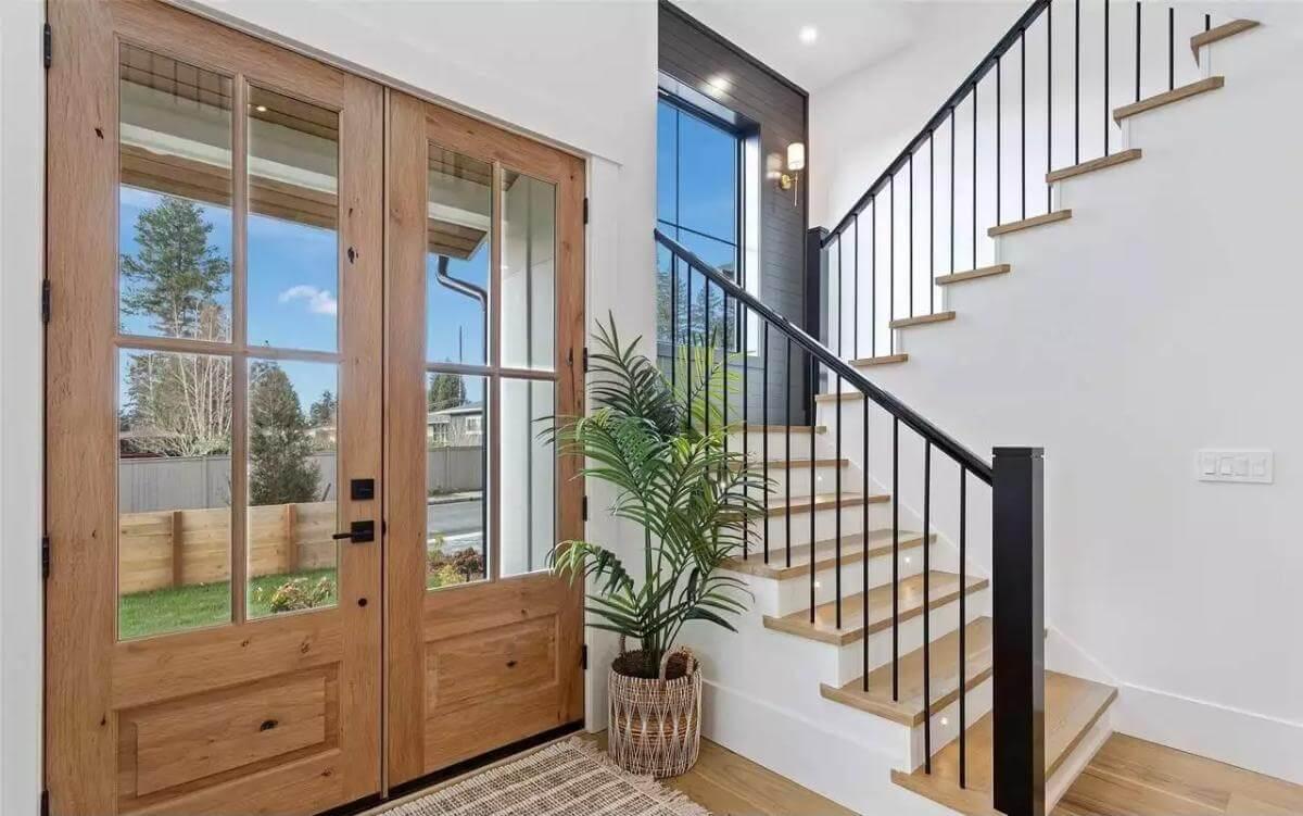 Step Inside a Bright Entryway with Stunning Wood Double Doors