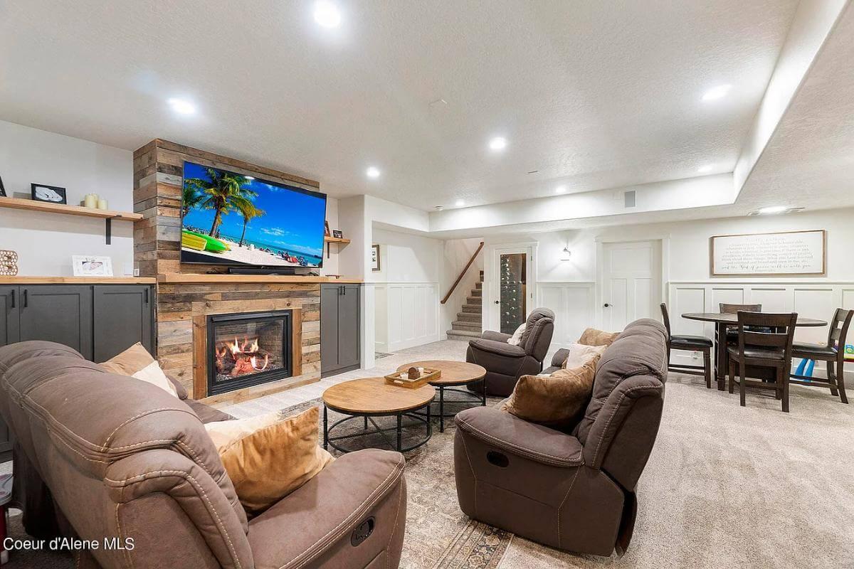 Relax in This Family Room with a Cozy Fireplace and Rustic Touches