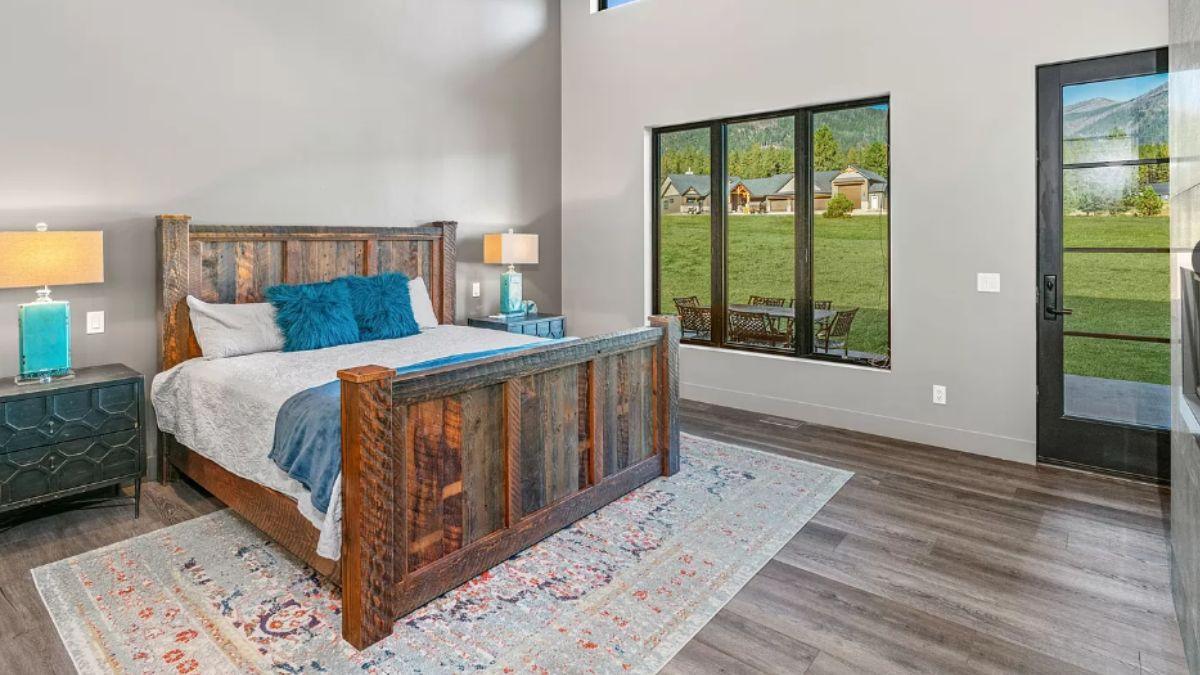Rustic Bedroom with Stunning Views from Tall Windows