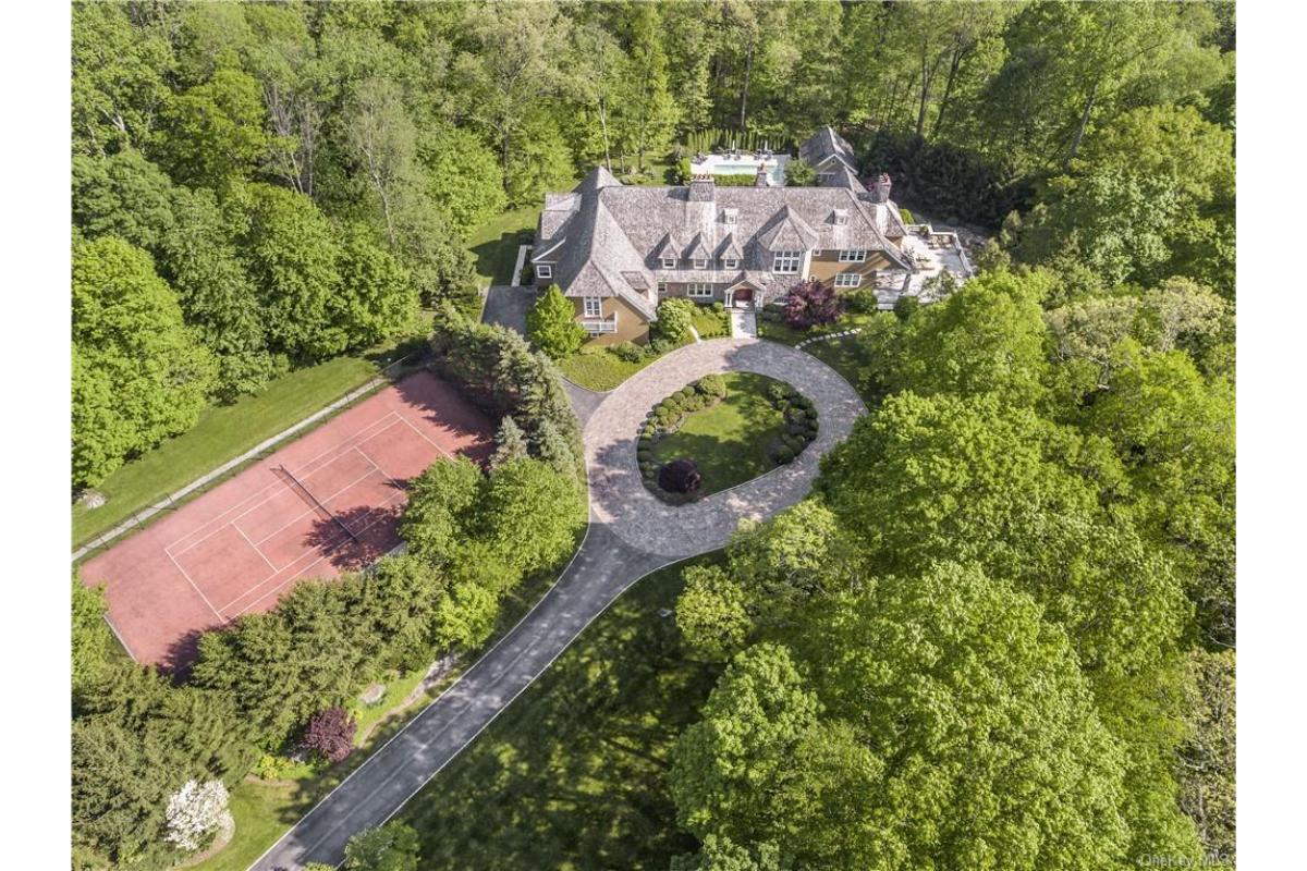 Aerial View of Estate with Tennis Court Nestled in Lush Greenery