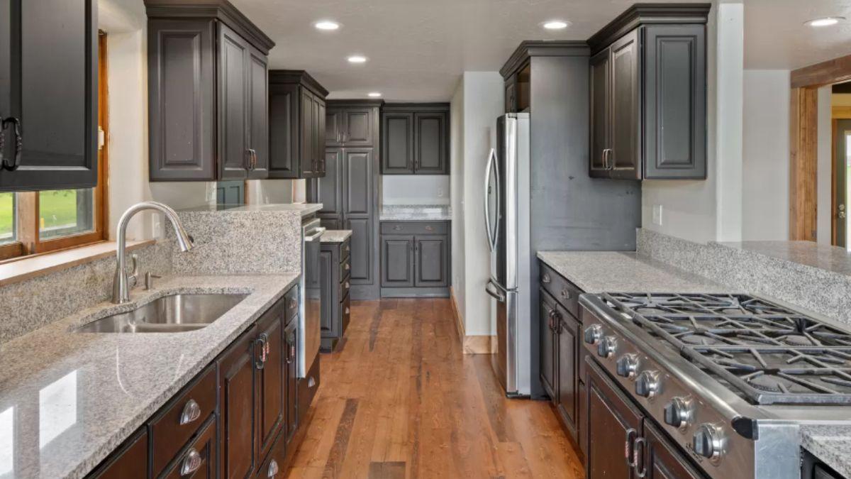 Explore This Galley-Style Kitchen with Granite Elegance
