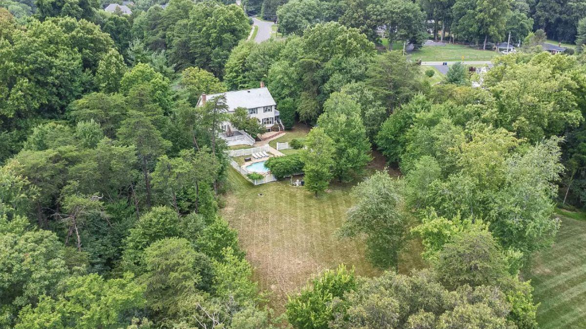 An Enchanting Forest Retreat with Expansive Lawn and Pool