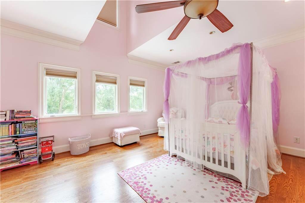Discover This Charming Nursery with Canopy Crib and Soothing Pastels