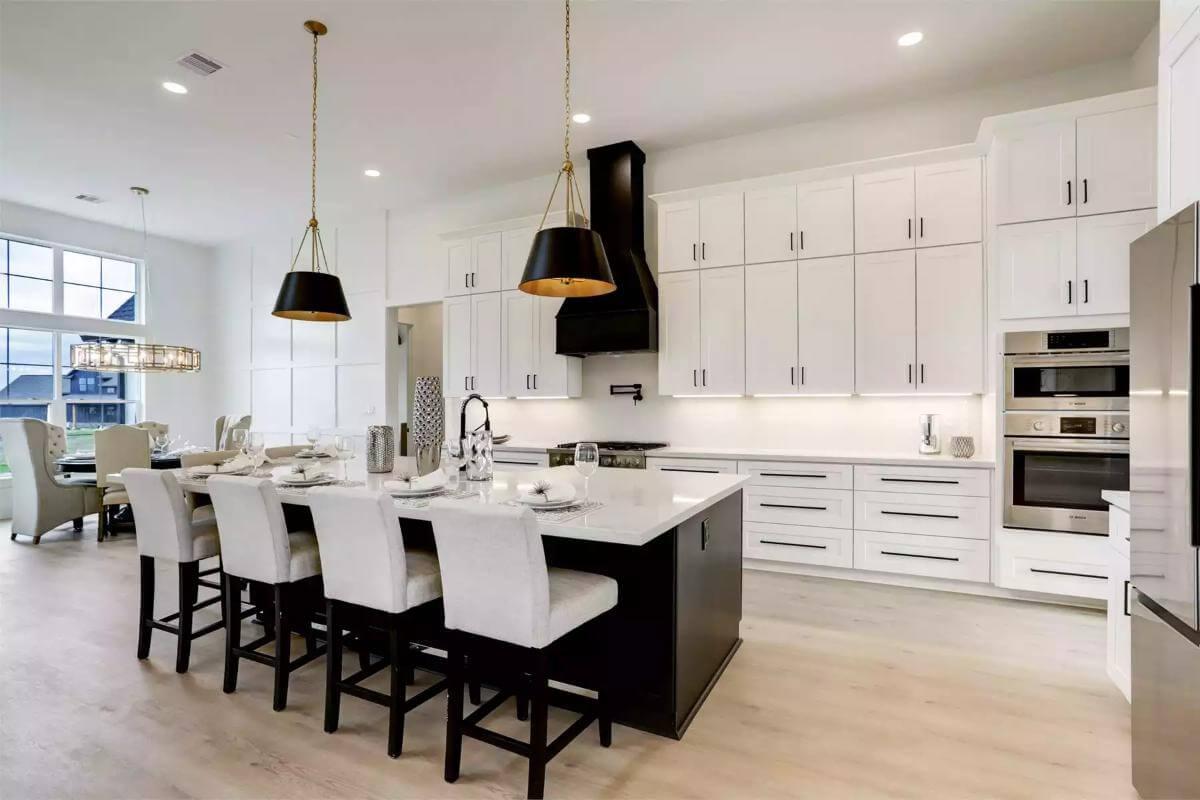 Check Out the Dramatic Black Range Hood in This Sleek Kitchen