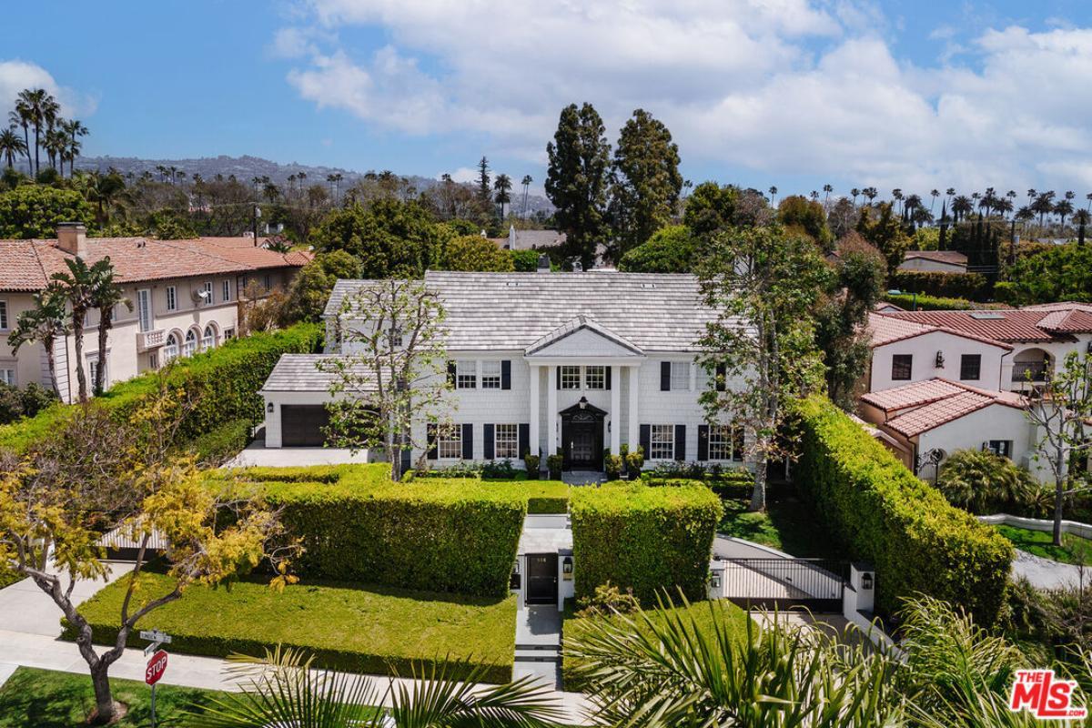 Colonial Elegance with Symmetrical Facade and Mature Landscaping