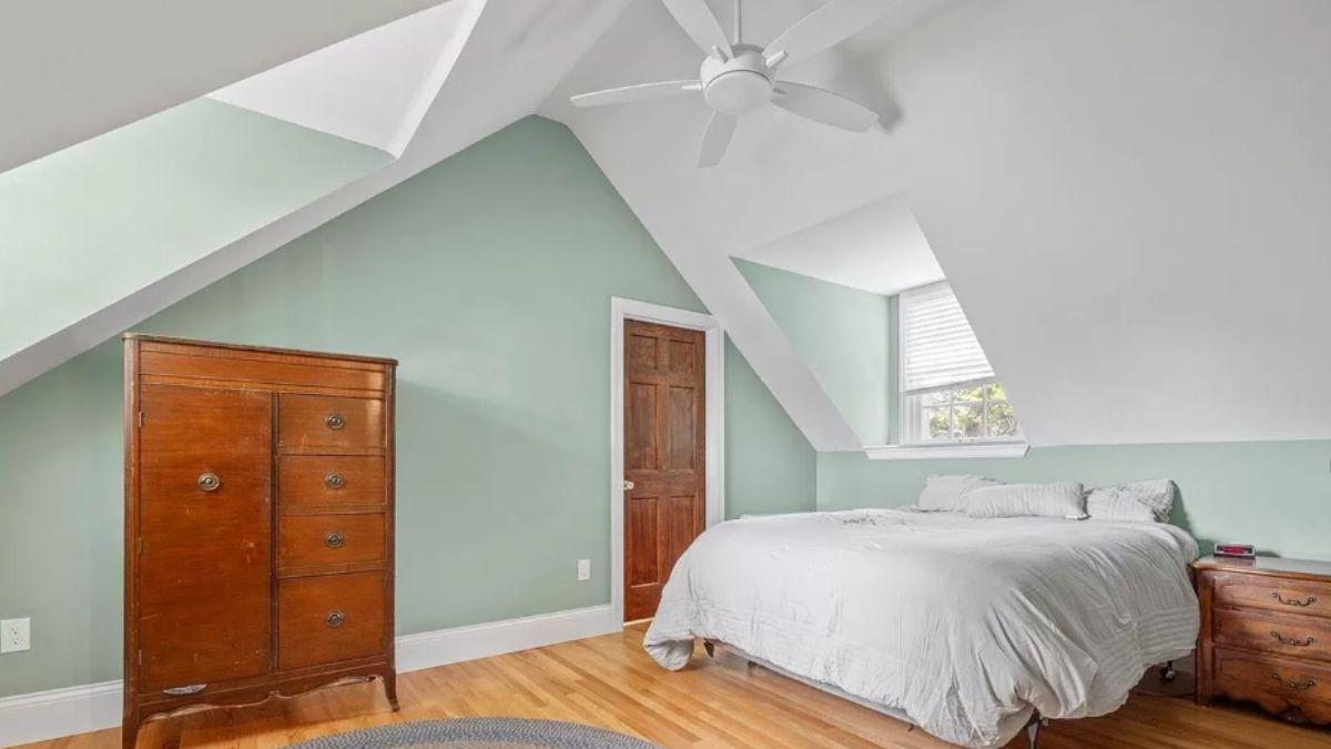 Unique Bedroom with Sloped Ceilings and Vintage Touches