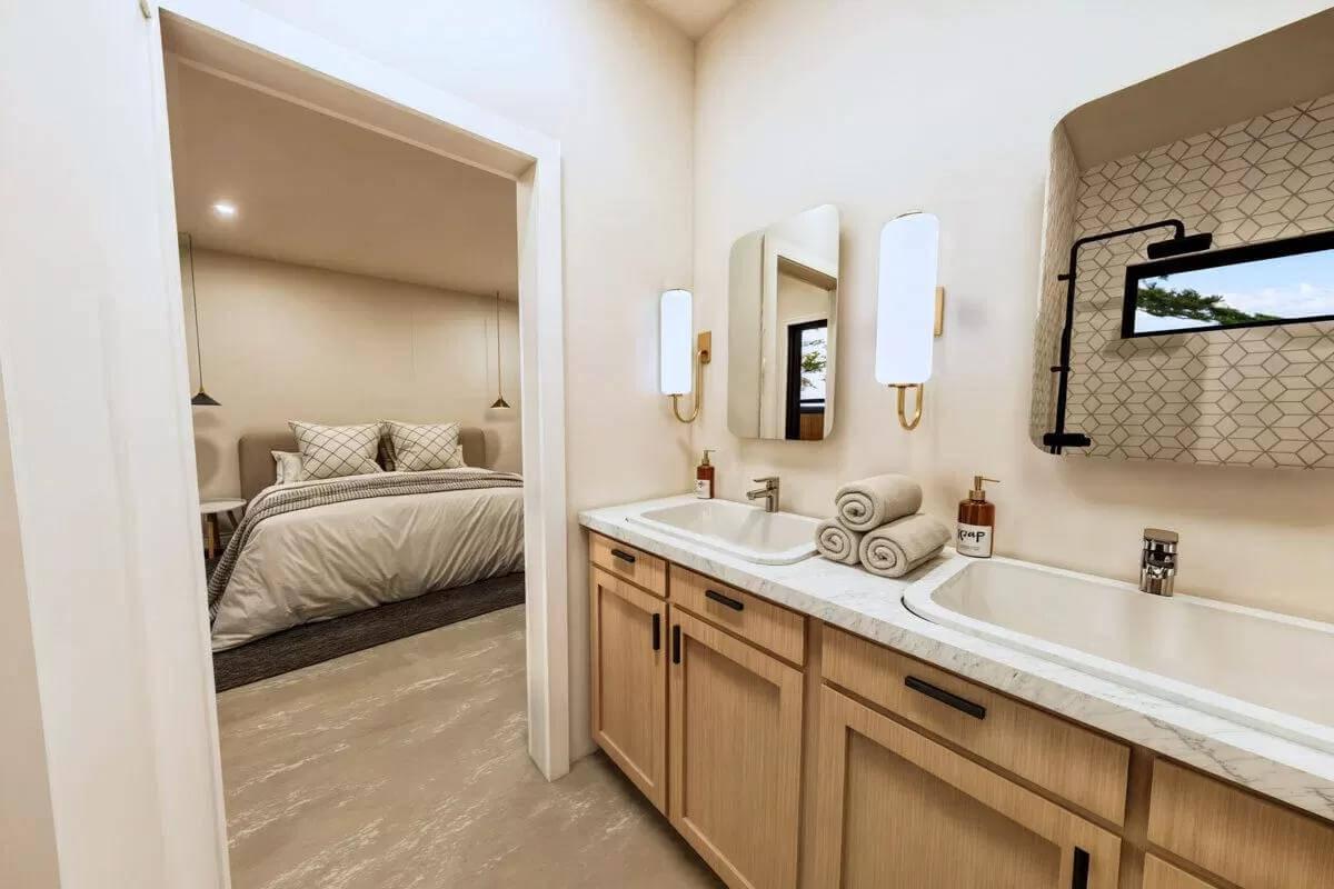 Spot the Clean Lines in This Dual Sink Bathroom Leading to a Serene Bedroom