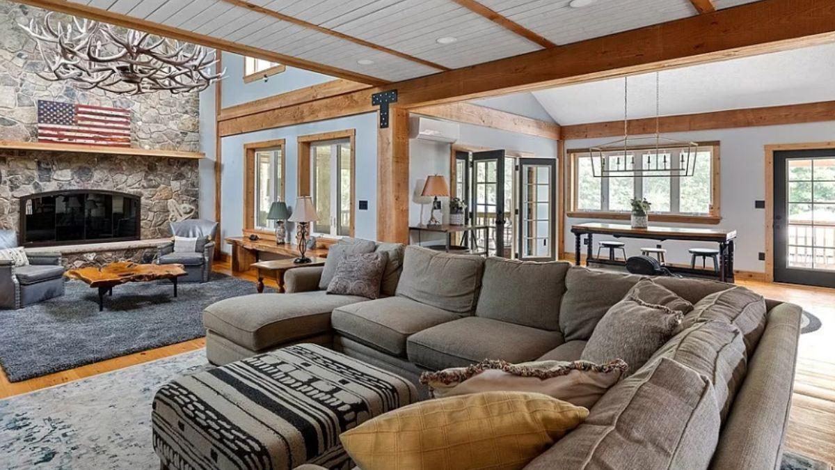 Explore This Inviting Living Room with a Grand Stone Fireplace
