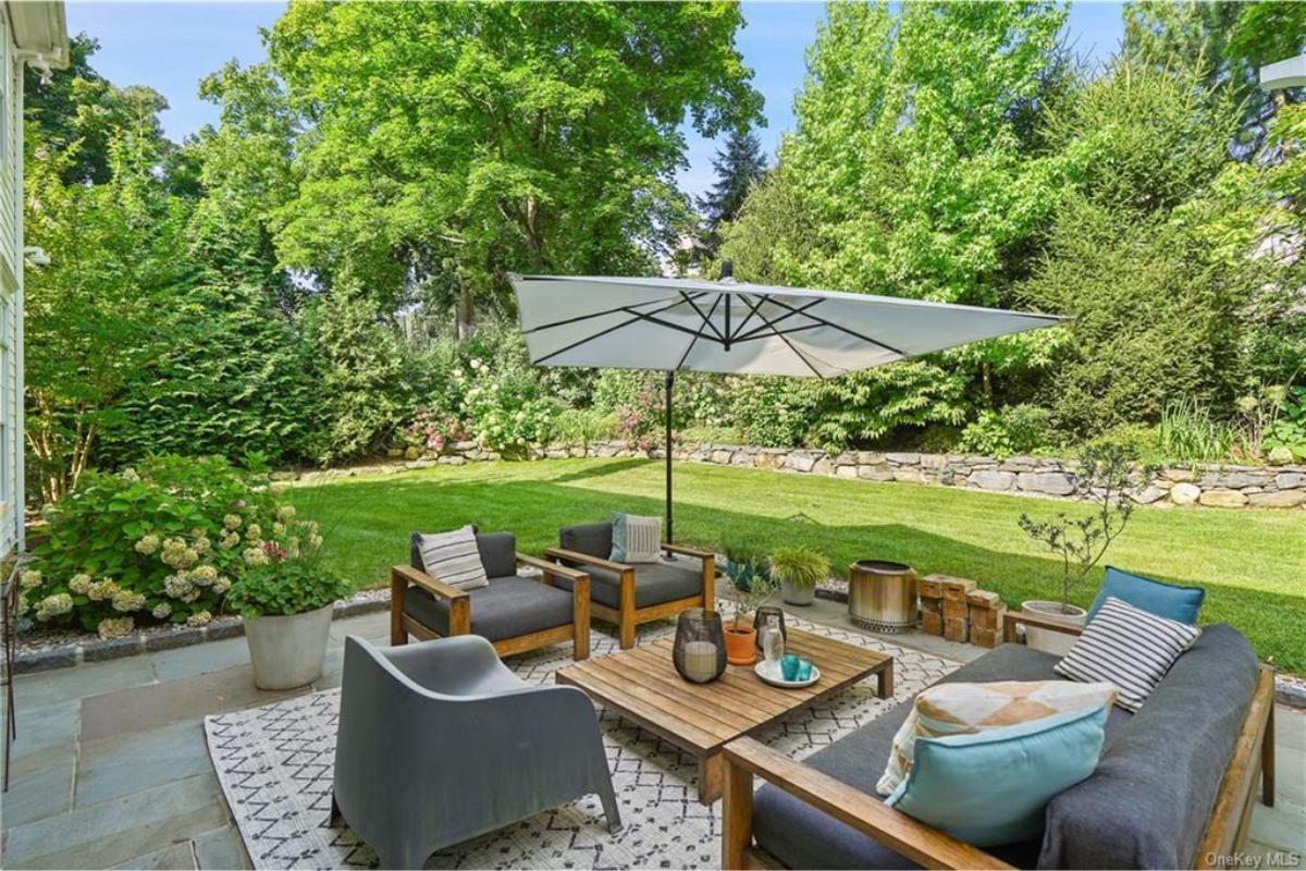 Outdoor Living Room with a Modern Twist and Natural Carpeting