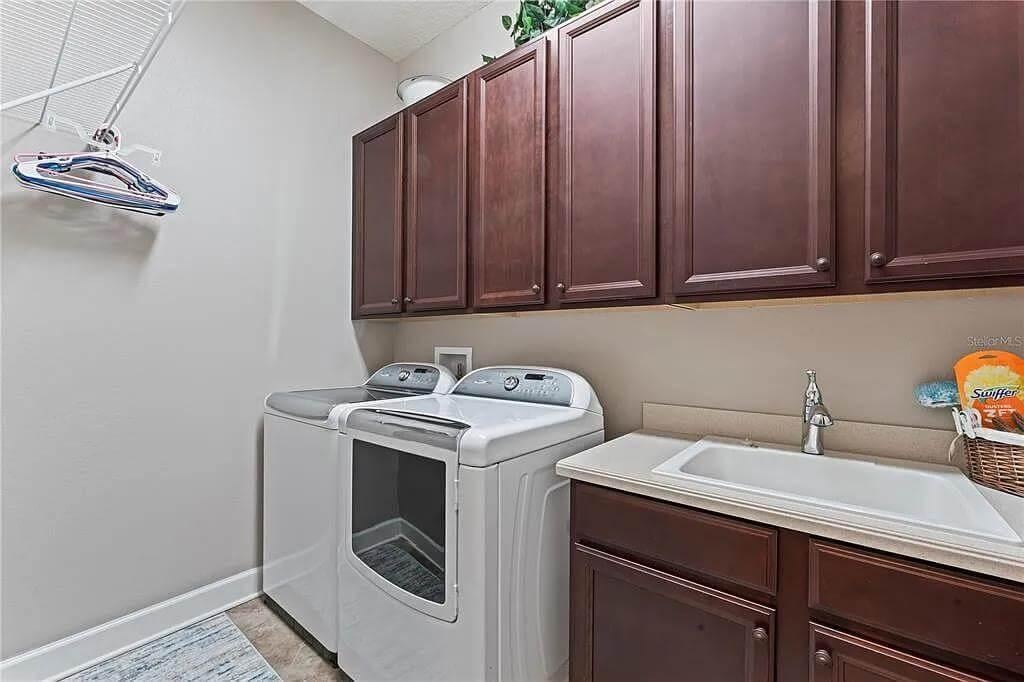 Functional Laundry Room with Ample Cabinet Storage