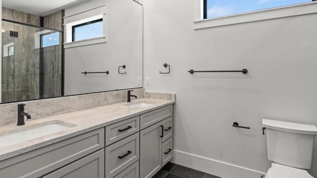 Check Out the Double Vanity with Matte Black Fixtures
