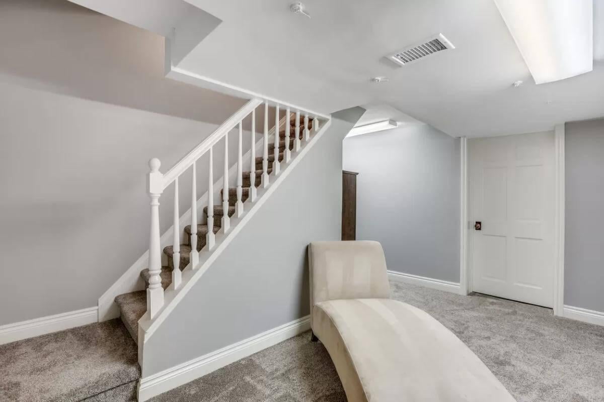 Check Out This Basement Nook with Cream Chaise Lounge