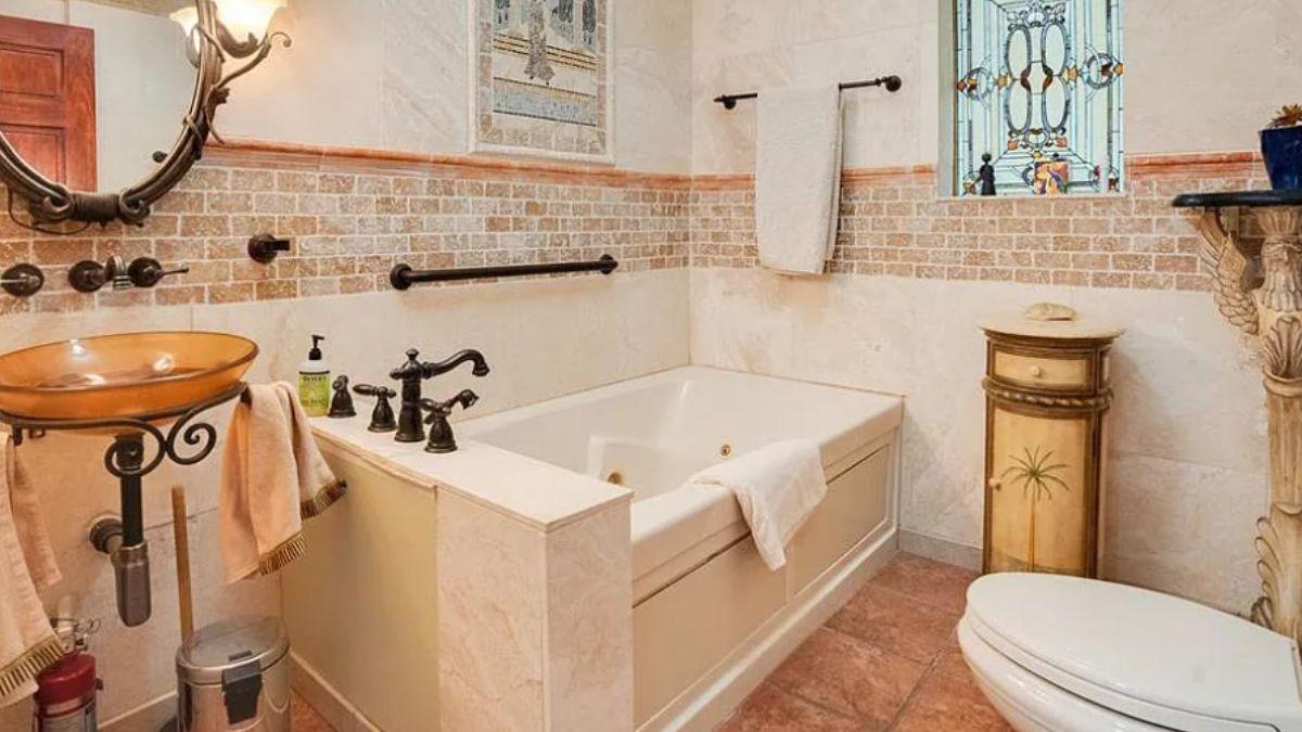 Discover the Rustic Ambiance with a Glass Bowl Sink in This Bathroom