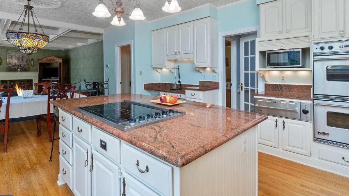 Dive Into This Functional Kitchen with a Massive Island and Vintage Charm