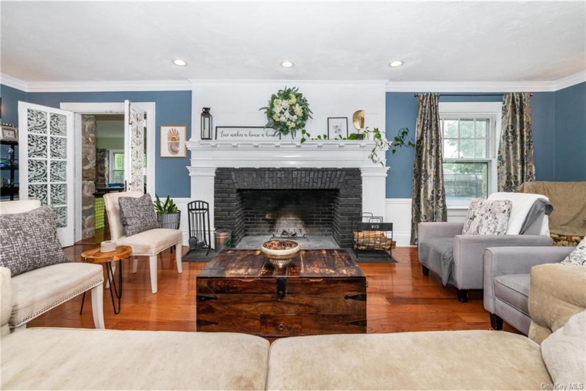Check Out the Statement Brick Fireplace in This Living Room