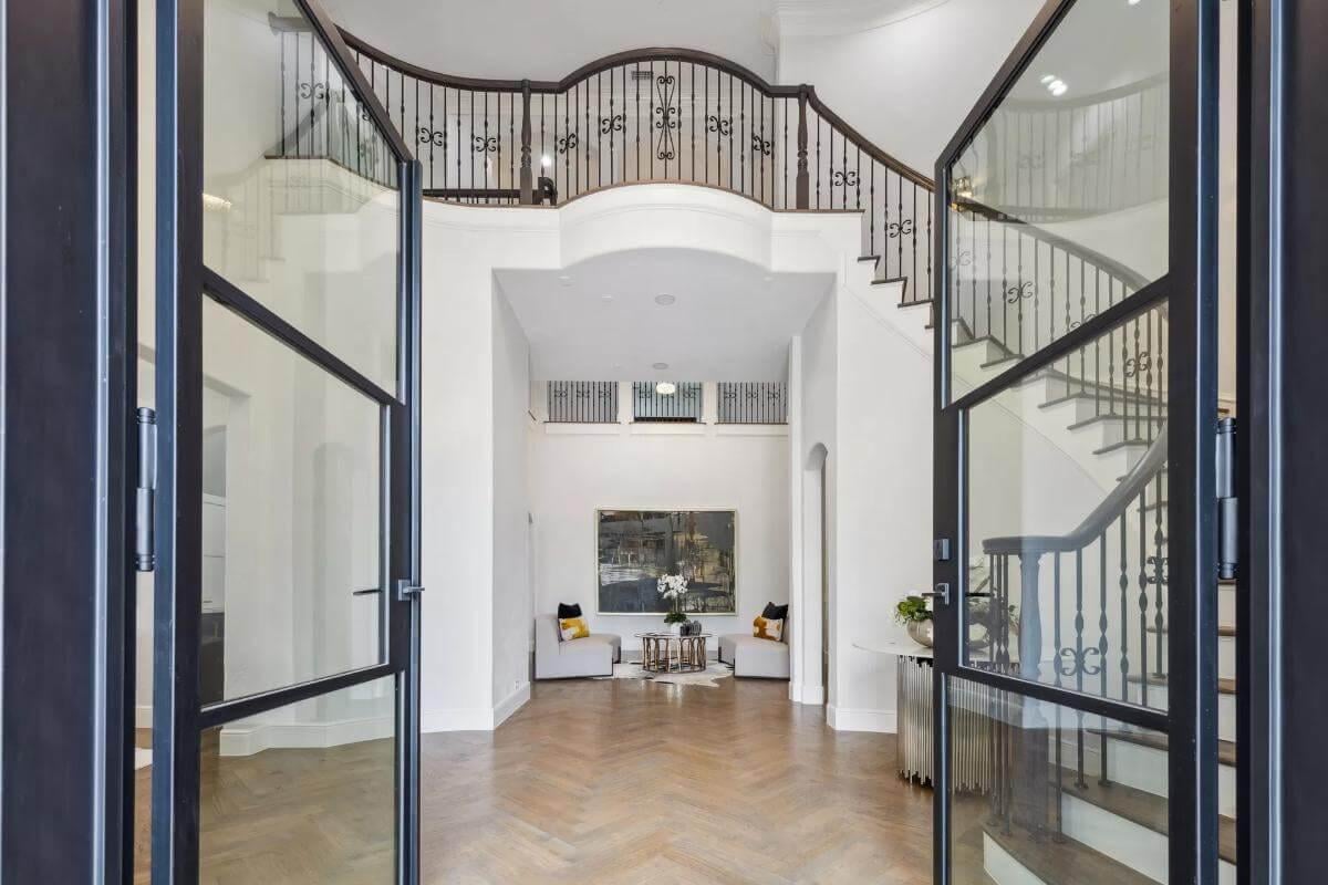 Grand Entrance with Elegant Staircase and Herringbone Floor