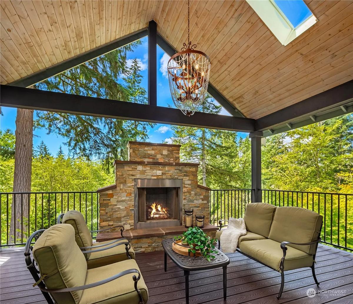 Relax by the Stone Fireplace on This Vaulted Deck Overlooking Nature