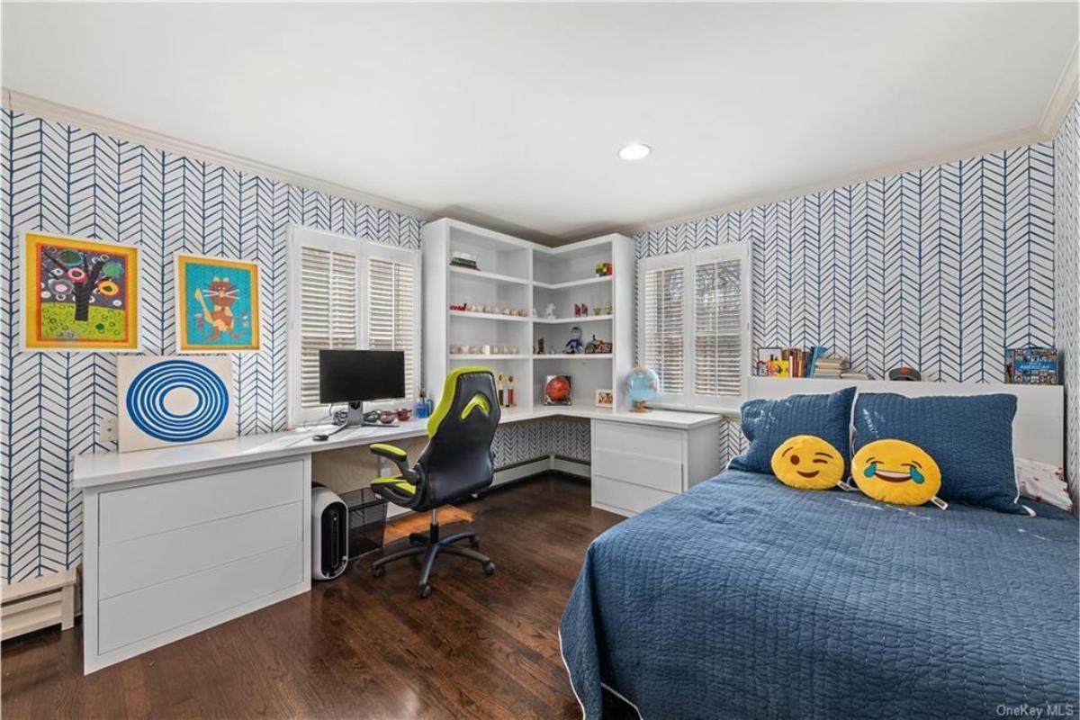 Explore This Playful Bedroom with Built-In Desk and Bold Patterns
