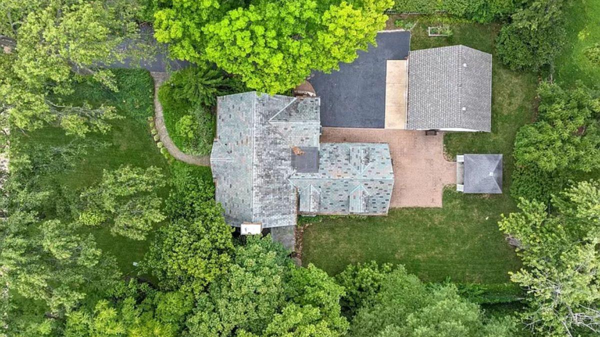 Aerial View Highlighting the Expansive Grounds and Detached Garage