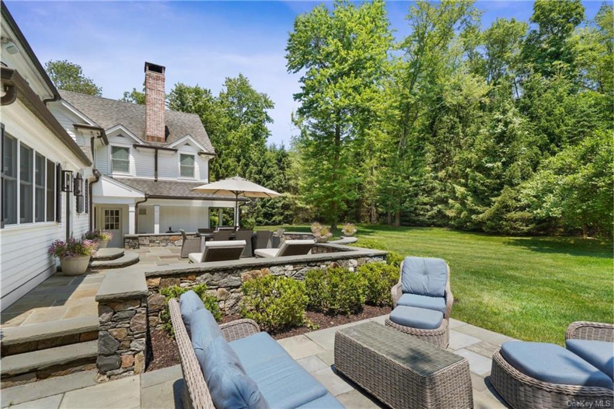 Relax in This Beautiful Backyard Patio with Stone Detailing