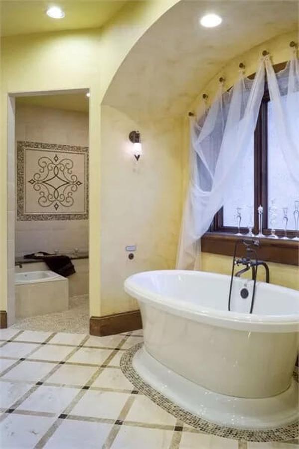 Wow, Look at That Freestanding Tub Under the Draped Arch!