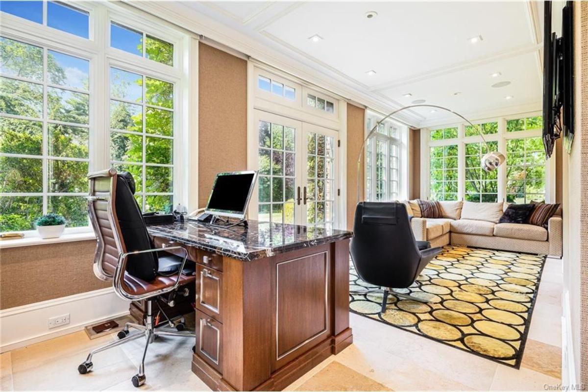 Check Out This Sunlit Office with a Cozy Seating Area