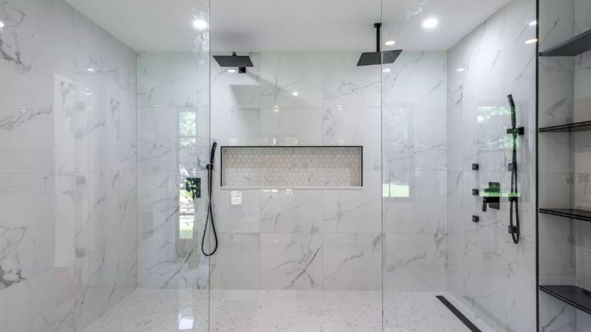 Check Out the Dual Rainfall Showerheads and Marble Elegance in This Luxurious Bathroom