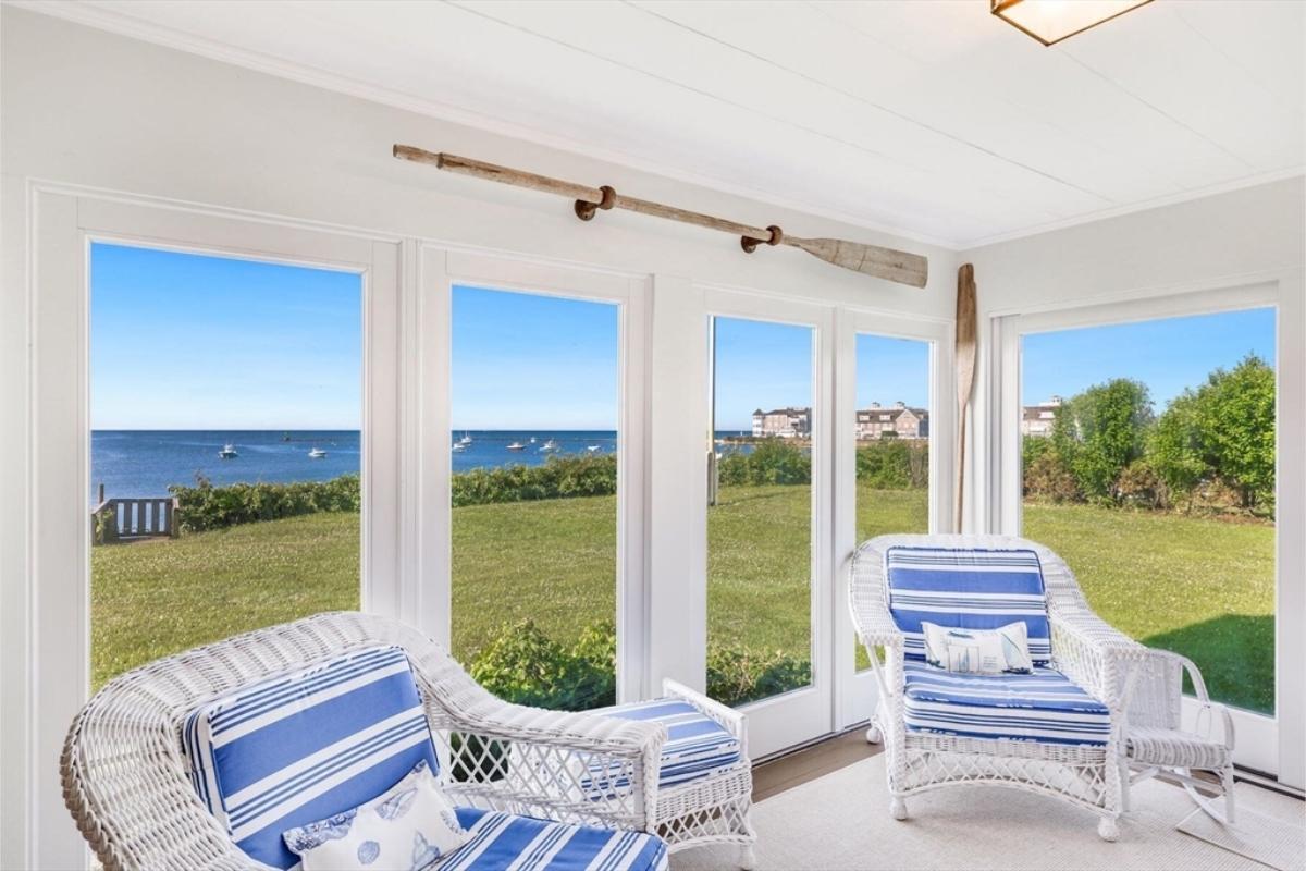 Sunroom with Wicker Seating and Coastal Views