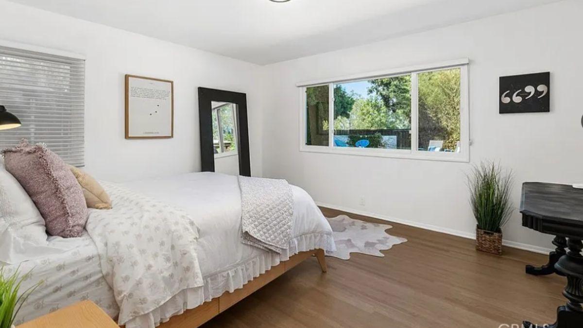 Serene Bedroom with Floor-to-Ceiling Windows and Thoughtful Decor