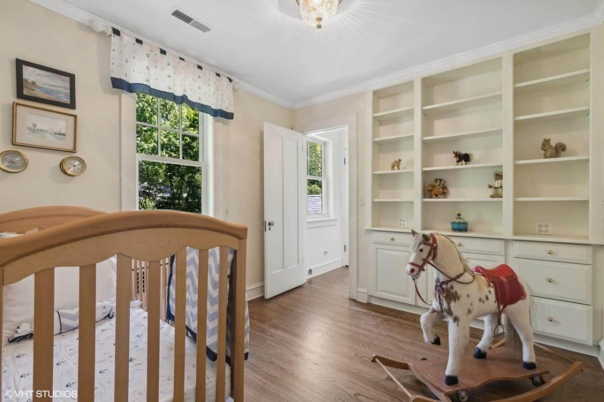 Nursery Charm with Built-In Shelving and a Nostalgic Rocking Horse