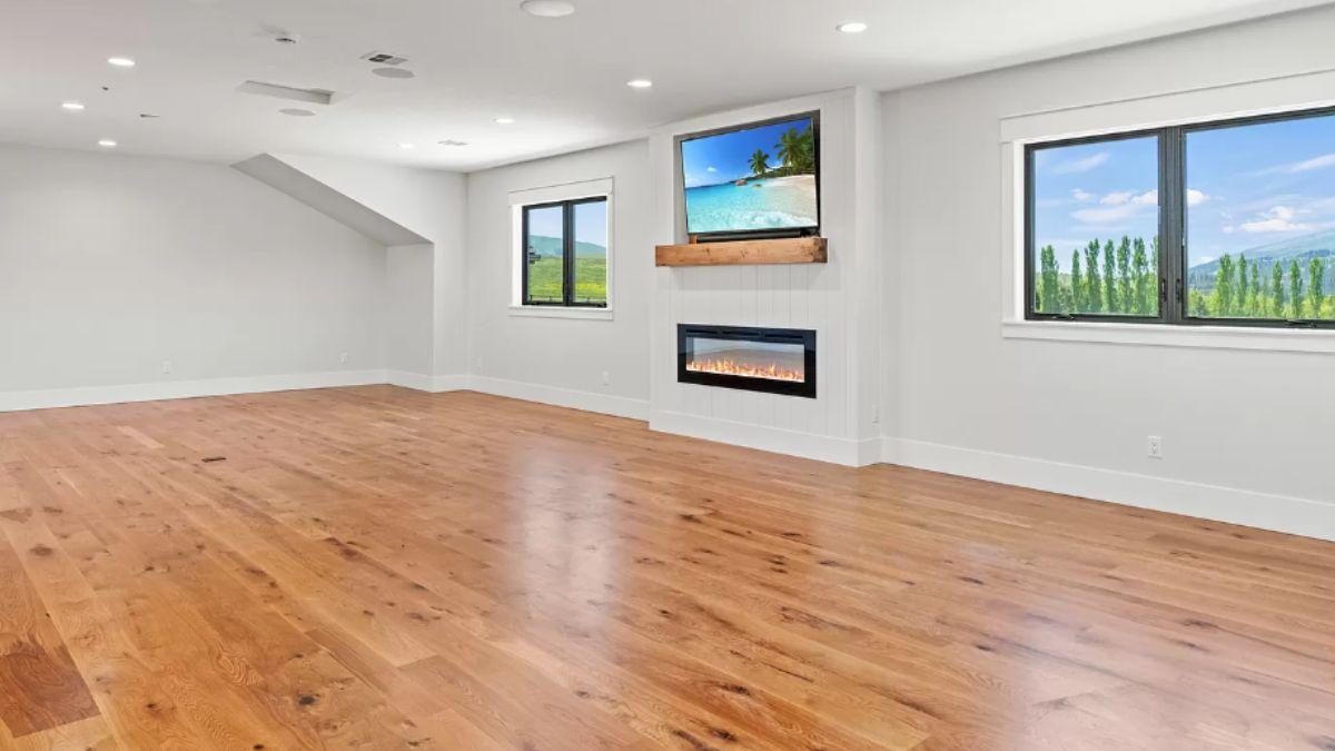 Spacious Bonus Room Featuring a Sleek Modern Fireplace