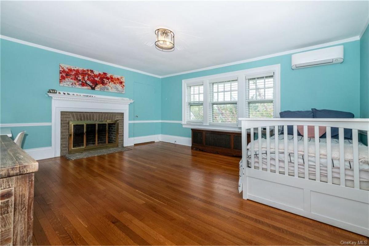 Spot the Brilliant Teal Walls in This Spacious Bedroom