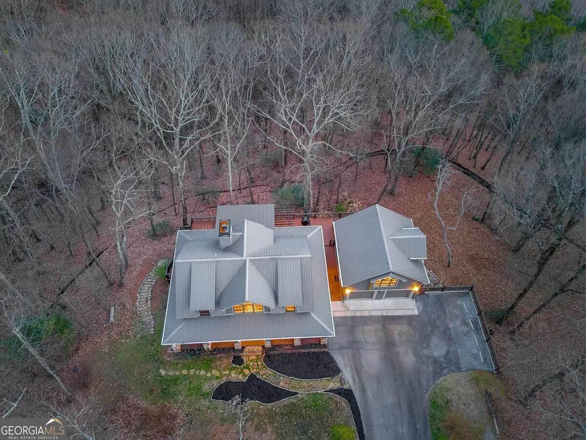 Discover This Secluded Home with Metal Roof Nestled in the Woods