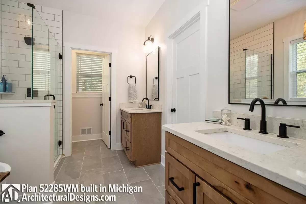 Bathroom Refresh with Warm Wood Vanities and Modern Black Fixtures