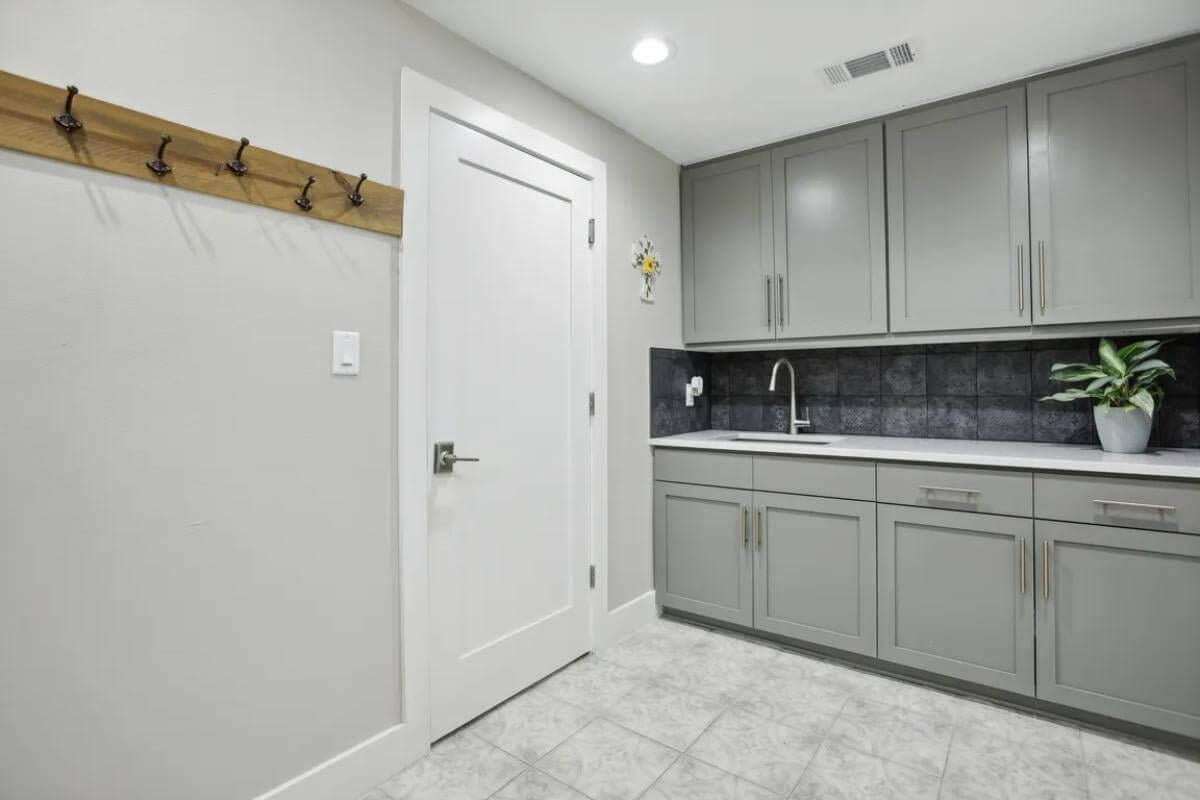 Explore This Functional Laundry Room with a Practical Sink Area