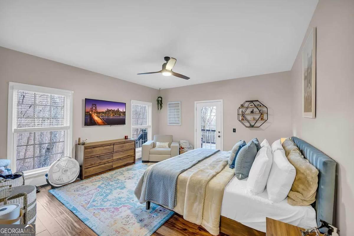 Relax in a Bedroom with a View and Vibrant Area Rug