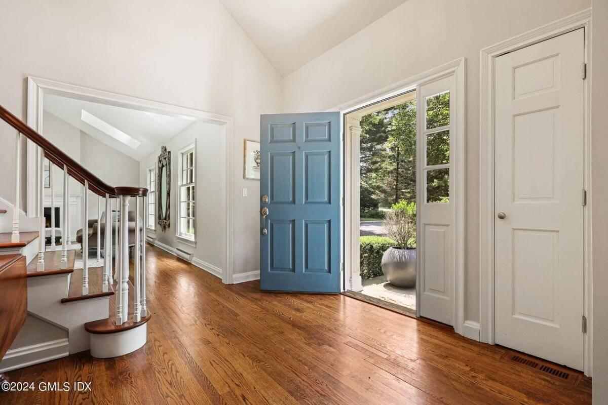 Notice the Inviting Entryway with a Pop of Color on the Front Door
