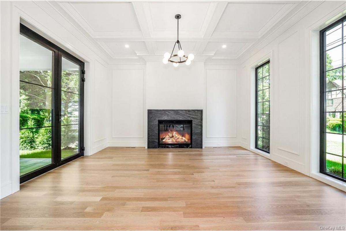 Wow, Check Out This Living Room with a Bold Black Marble Fireplace