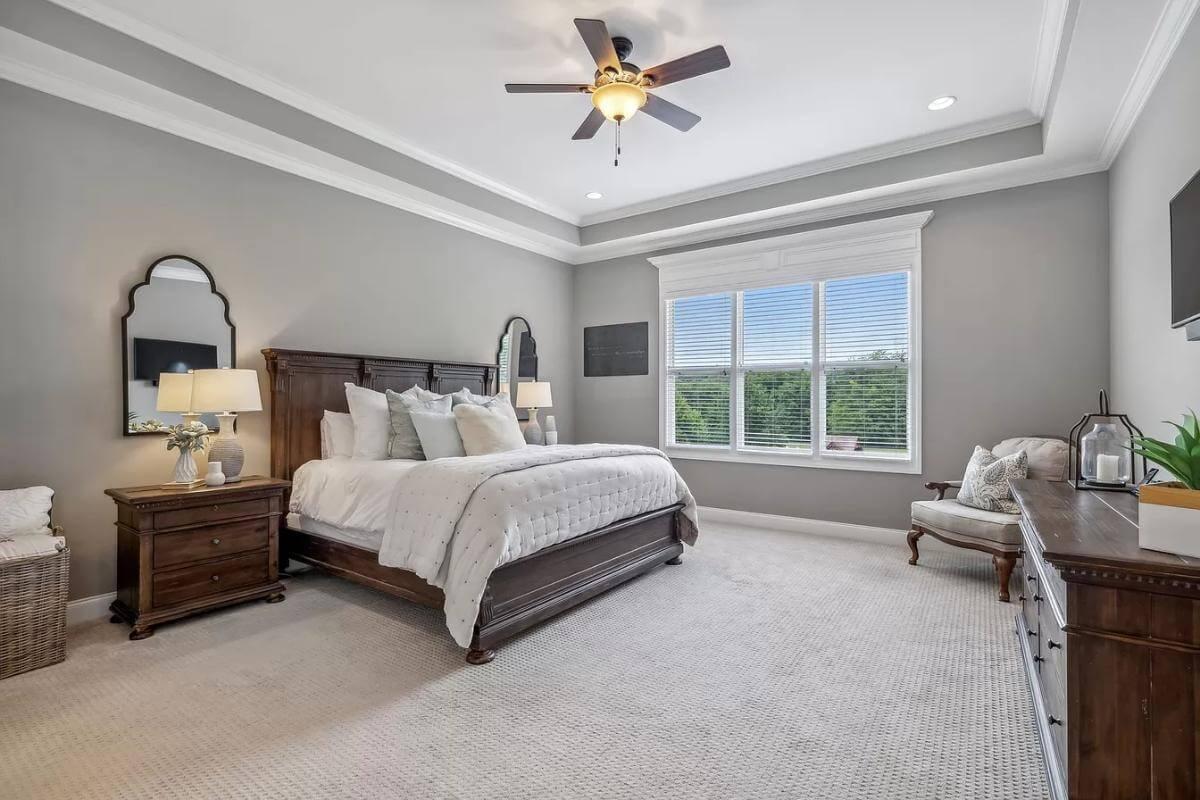 Elegant Bedroom with Tray Ceiling and Natural Light