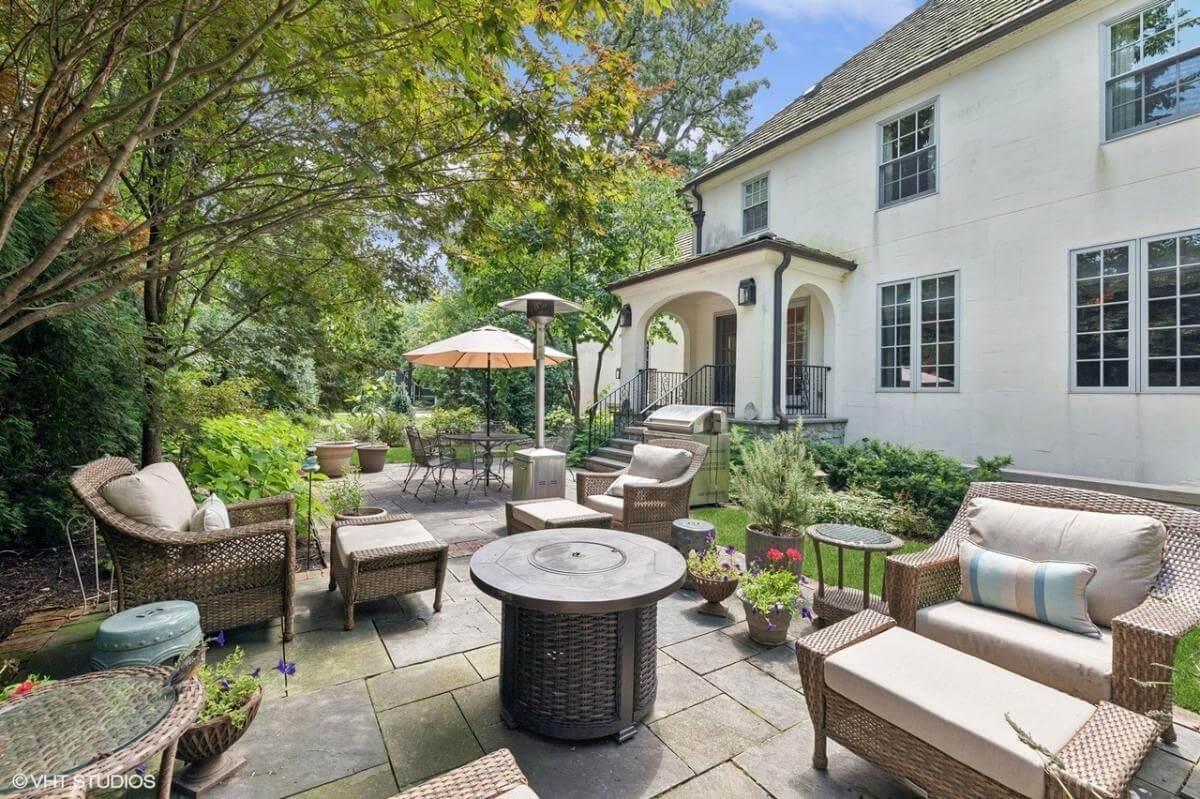 Relax on the Garden Patio with Wicker Seating and Fire Pit